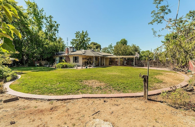 5432 E Swift Ave, Fresno, CA 93727 - rear view of property with a patio and a fenced backyard