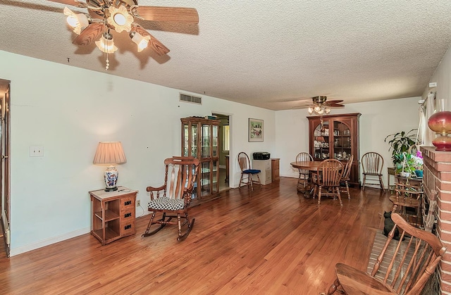 5432 E Swift Ave, Fresno, CA 93727 - living area with a ceiling fan, wood finished floors, and a textured ceiling