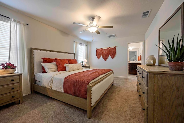 2018 Catherine Ave Unit 2043S, Sanger, CA 93657 - bedroom with light colored carpet, ensuite bathroom, and ceiling fan