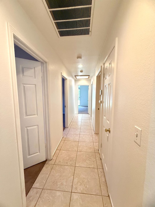 4688 W Weldon Ave, Fresno, CA 93722 - corridor with light tile patterned flooring