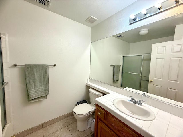 4688 W Weldon Ave, Fresno, CA 93722 - bathroom with vanity, a shower with door, and tile patterned floors