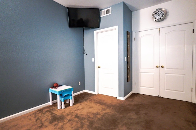 10080 N Dearing Ave, Fresno, CA 93730 - bedroom with dark colored carpet and baseboards