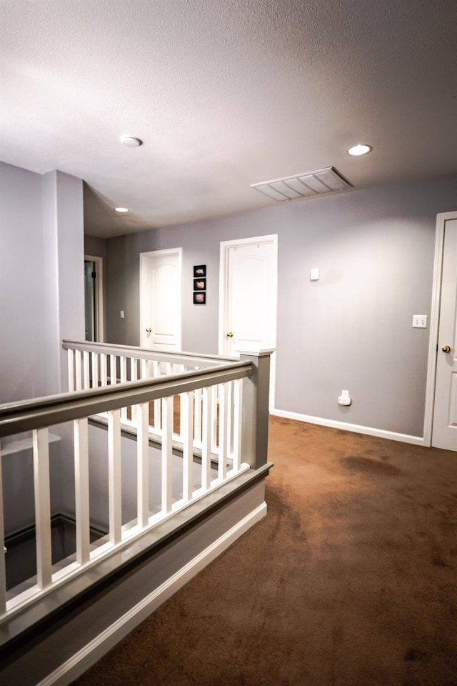10080 N Dearing Ave, Fresno, CA 93730 - hall with carpet, recessed lighting, a textured ceiling, and an upstairs landing