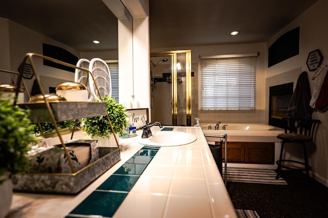 10080 N Dearing Ave, Fresno, CA 93730 - bathroom featuring a bath, a shower stall, double vanity, and recessed lighting