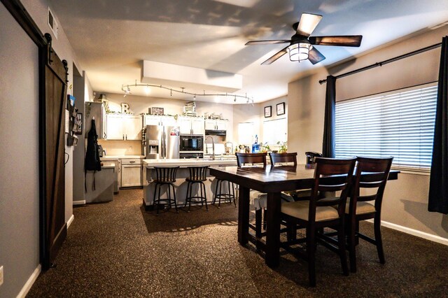 10080 N Dearing Ave, Fresno, CA 93730 - dining room featuring ceiling fan and a barn door