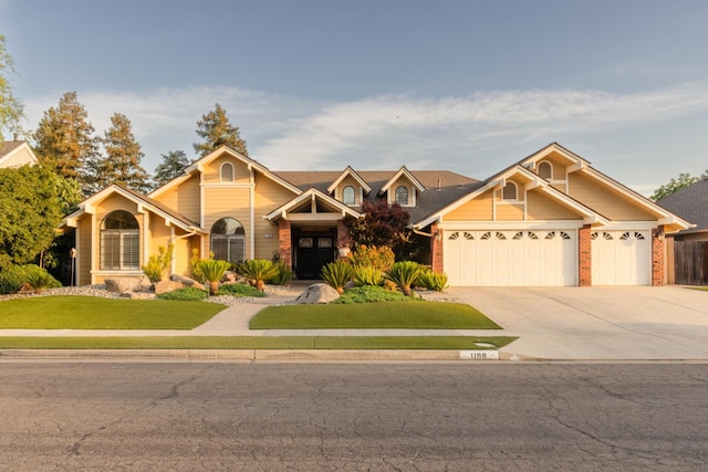1199 E Cole Ave, Fresno, CA 93720 - view of front of home with an attached garage, a front lawn, concrete driveway, and brick siding