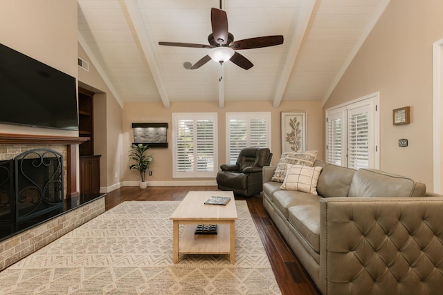 1199 E Cole Ave, Fresno, CA 93720 - living room with wood finished floors, ceiling fan, a fireplace with raised hearth, and wood ceiling