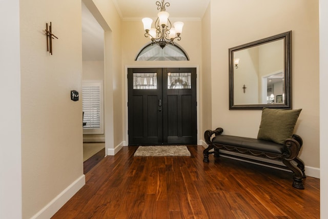 1199 E Cole Ave, Fresno, CA 93720 - entryway featuring a chandelier, ornamental molding, and dark wood-style flooring