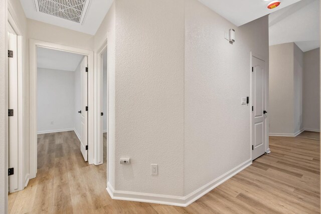 2540 E Seeger Ave, Visalia, CA 93292 - corridor with light wood-style flooring and baseboards