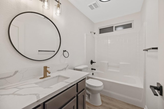 2540 E Seeger Ave, Visalia, CA 93292 - bathroom with vanity, wood finished floors, and tub / shower combination