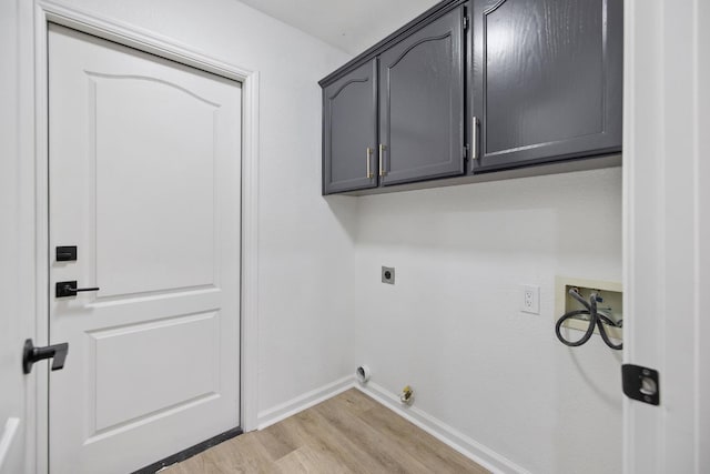 2540 E Seeger Ave, Visalia, CA 93292 - laundry room with hookup for an electric dryer, light wood finished floors, cabinet space, and hookup for a washing machine