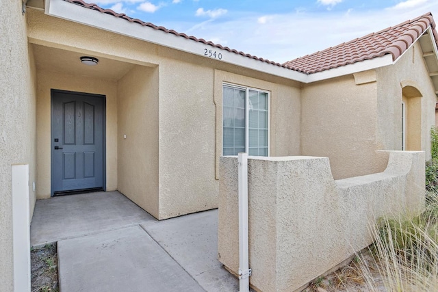 2540 E Seeger Ave, Visalia, CA 93292 - entrance to property with stucco siding and a tile roof