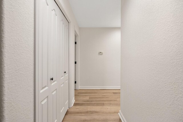 2540 E Seeger Ave, Visalia, CA 93292 - hall featuring light wood-style floors and a textured wall