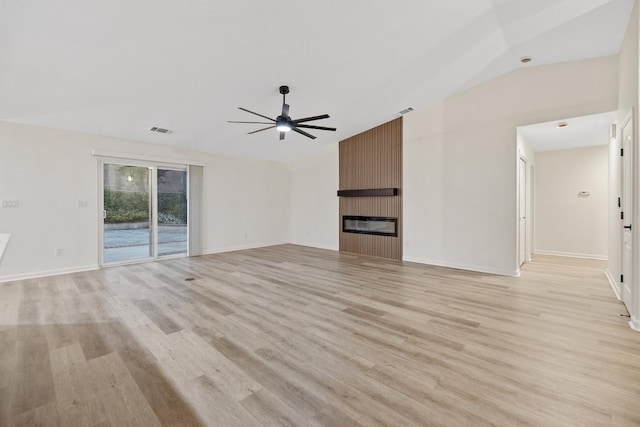 2540 E Seeger Ave, Visalia, CA 93292 - unfurnished living room with a ceiling fan, light wood-type flooring, a fireplace, and lofted ceiling