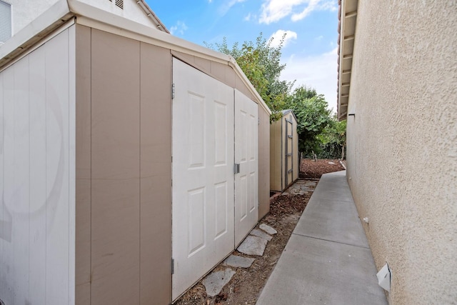 2540 E Seeger Ave, Visalia, CA 93292 - view of side of property with a storage shed and stucco siding