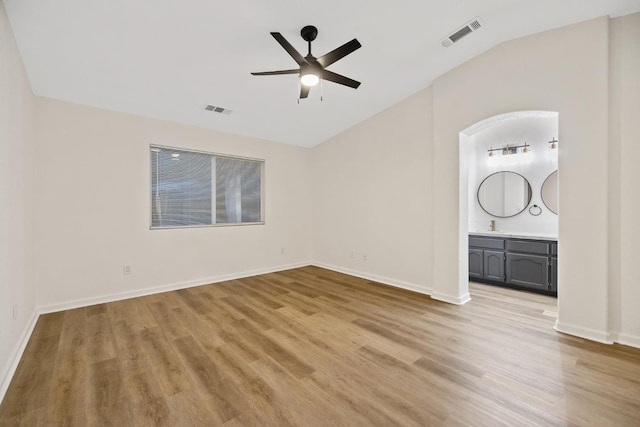 2540 E Seeger Ave, Visalia, CA 93292 - empty room featuring light wood-style floors, a ceiling fan, and lofted ceiling