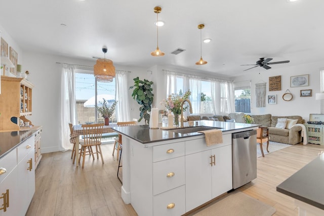 1961 Oak Ln, Clovis, CA 93611 - kitchen featuring stainless steel dishwasher, plenty of natural light, light wood-style flooring, and a ceiling fan