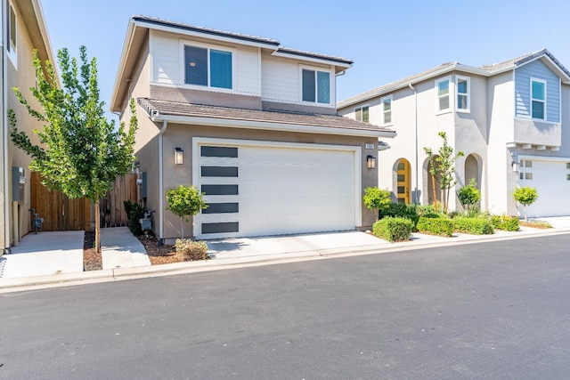1961 Oak Ln, Clovis, CA 93611 - view of front of property with a garage, stucco siding, and driveway