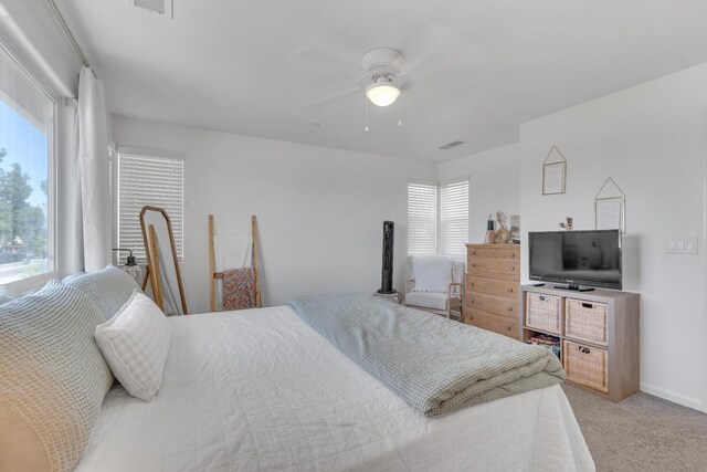 1961 Oak Ln, Clovis, CA 93611 - bedroom with multiple windows, light carpet, and ceiling fan