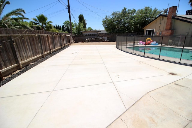 521 Williams Ave, Madera, CA 93637 - view of pool featuring a fenced backyard and a patio area