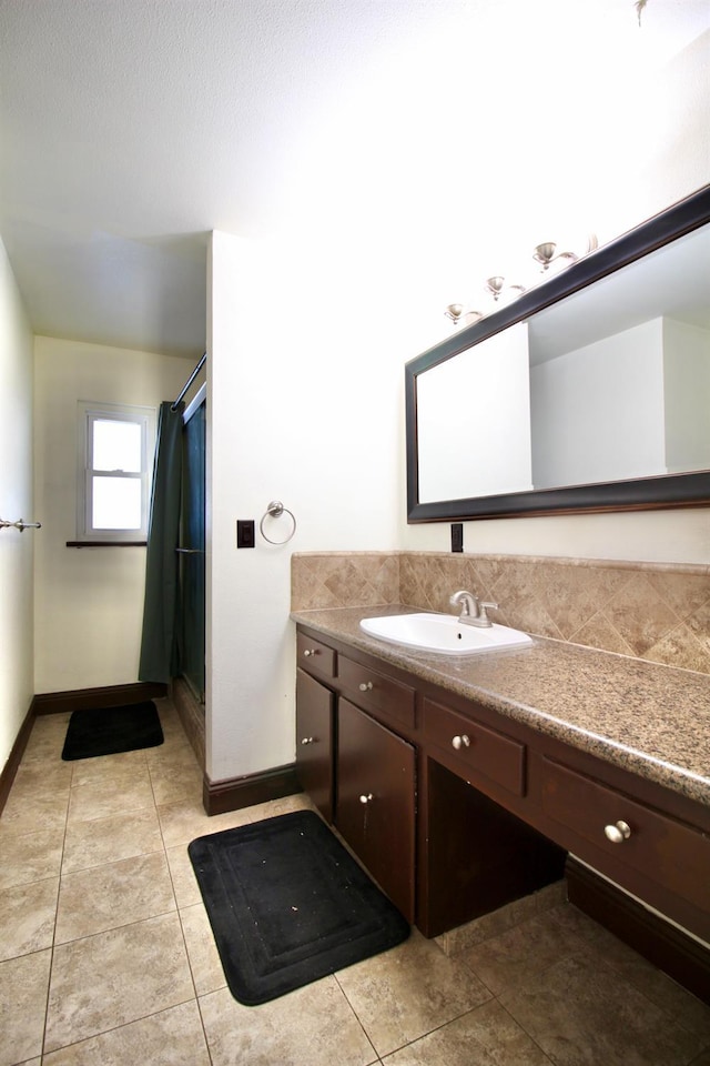521 Williams Ave, Madera, CA 93637 - full bathroom featuring vanity, a shower stall, and tile patterned flooring