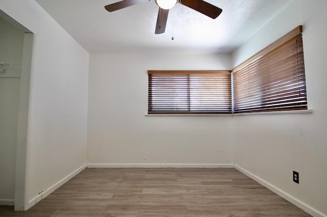 521 Williams Ave, Madera, CA 93637 - empty room with ceiling fan and wood finished floors