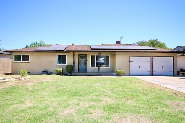 521 Williams Ave, Madera, CA 93637 - single story home with stucco siding, a garage, concrete driveway, solar panels, and covered porch