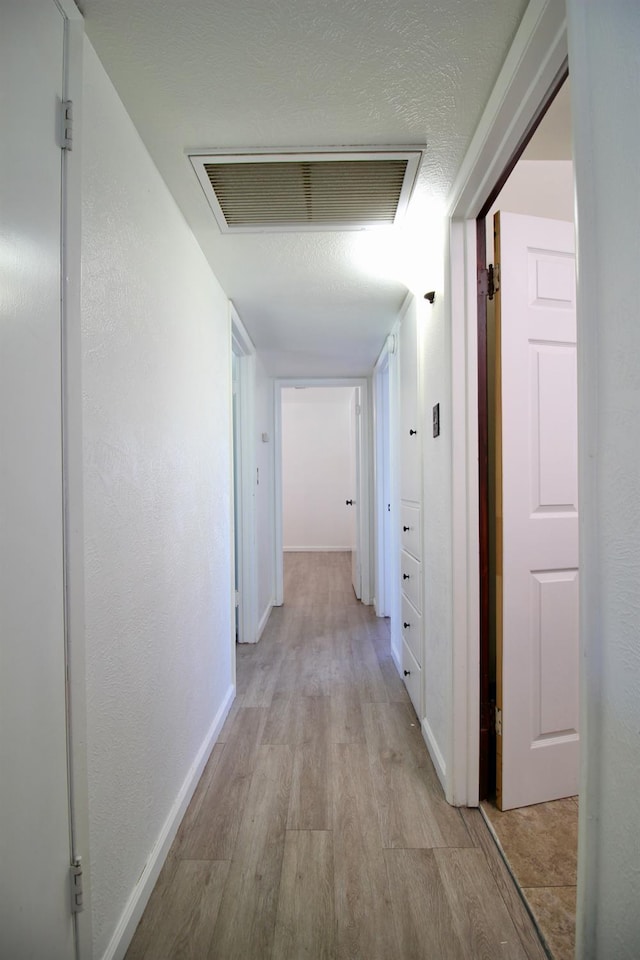 521 Williams Ave, Madera, CA 93637 - hallway featuring light wood finished floors and baseboards