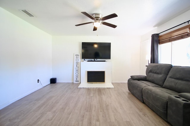 521 Williams Ave, Madera, CA 93637 - living area featuring ceiling fan, wood finished floors, and a brick fireplace