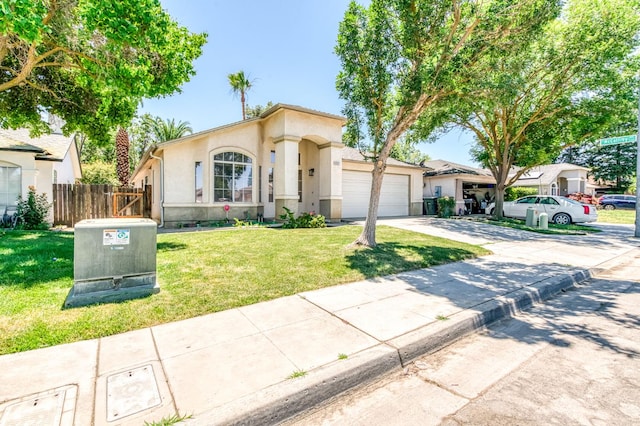 5537 W Oswego Ave, Fresno, CA 93722 - view of front facade with a garage, concrete driveway, and stucco siding