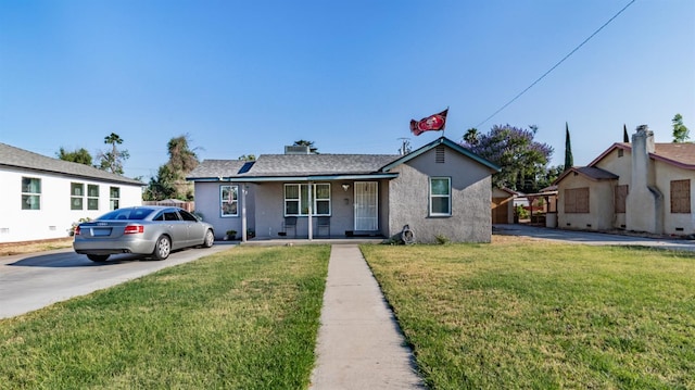 2004 E Clinton Ave, Fresno, CA 93703 - ranch-style home with a porch, a front yard, stucco siding, and concrete driveway