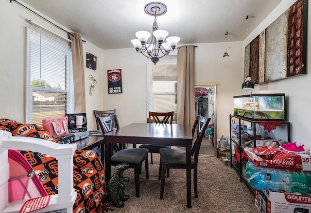 2004 E Clinton Ave, Fresno, CA 93703 - carpeted dining space with a chandelier