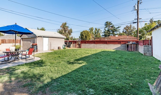 2004 E Clinton Ave, Fresno, CA 93703 - fenced backyard featuring an outdoor structure and a patio area