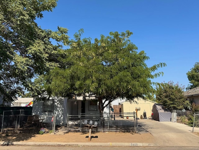 2465 S 11th St, Fresno, CA 93725 - view of property hidden behind natural elements featuring a fenced front yard