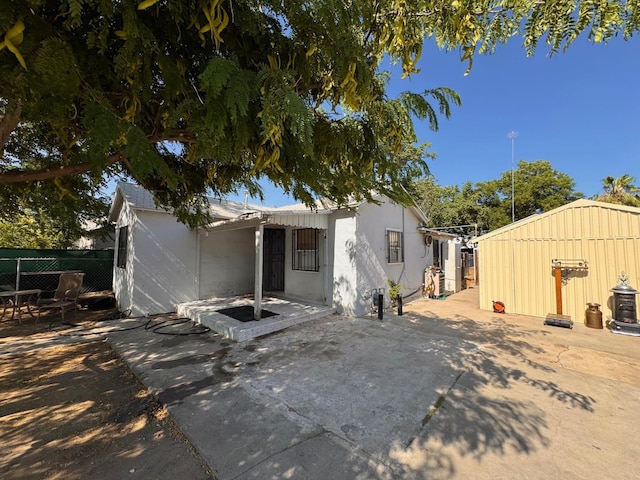 2465 S 11th St, Fresno, CA 93725 - rear view of house featuring a patio
