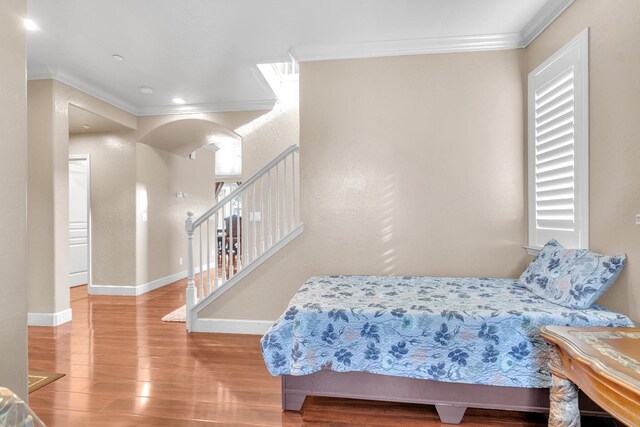 3017 W Oleander Ave, Fresno, CA 93706 - bedroom featuring ornamental molding, wood finished floors, arched walkways, and recessed lighting