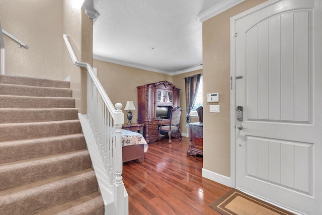 3017 W Oleander Ave, Fresno, CA 93706 - foyer with stairway, ornamental molding, and wood finished floors
