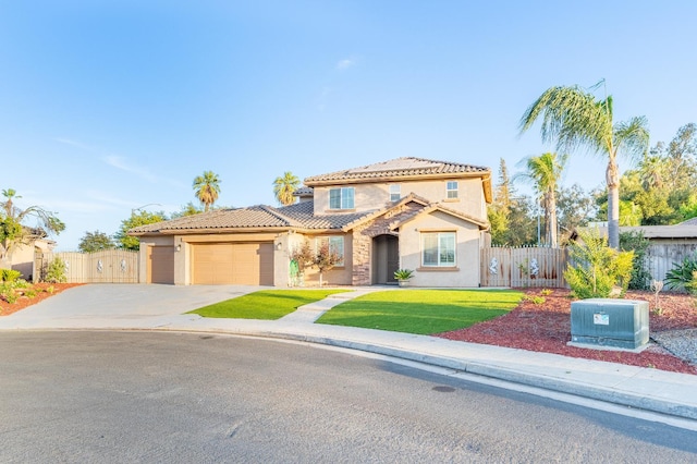 3017 W Oleander Ave, Fresno, CA 93706 - mediterranean / spanish-style home with stucco siding, an attached garage, a tiled roof, and concrete driveway