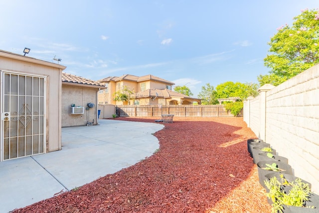 3017 W Oleander Ave, Fresno, CA 93706 - fenced backyard featuring a patio area and a wall unit AC