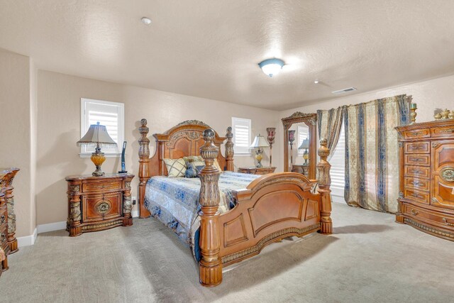 3017 W Oleander Ave, Fresno, CA 93706 - carpeted bedroom with multiple windows and a textured ceiling