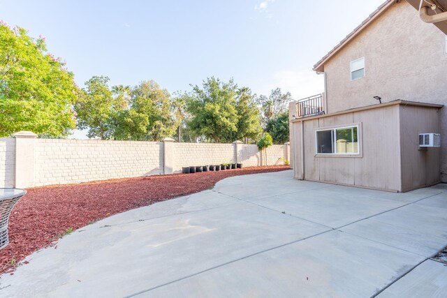 3017 W Oleander Ave, Fresno, CA 93706 - patio / terrace with a fenced backyard, a patio area, and a wall unit AC