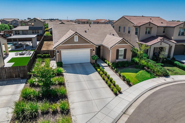 3430 Hermosa Ave, Clovis, CA 93619 - view of front of home with a residential view, stucco siding, a garage, driveway, and a tile roof