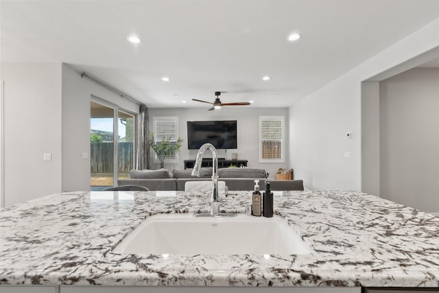 3430 Hermosa Ave, Clovis, CA 93619 - kitchen with recessed lighting, light stone countertops, open floor plan, and a ceiling fan