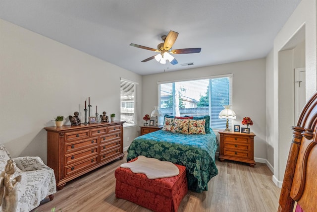 7387 E Robinson Ave, Fresno, CA 93737 - bedroom featuring light wood-type flooring and a ceiling fan