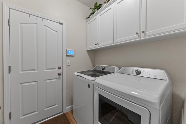 7387 E Robinson Ave, Fresno, CA 93737 - washroom with cabinet space, washer and dryer, and wood finished floors