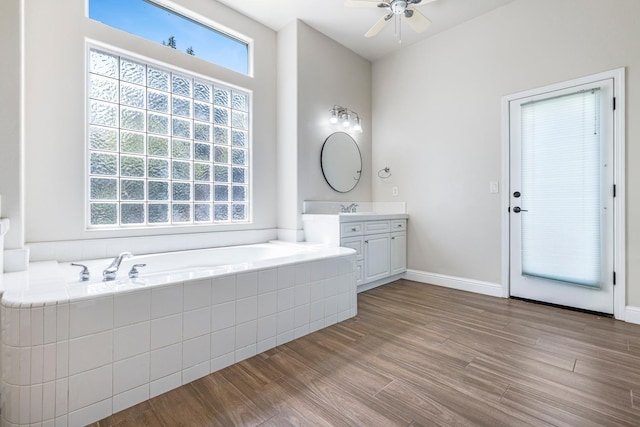 1552 N Gateway Ave, Clovis, CA 93619 - bathroom featuring vanity, ceiling fan, a garden tub, and wood finished floors