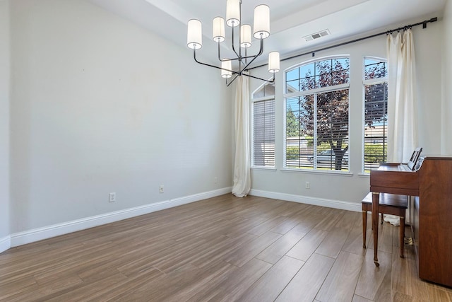 1552 N Gateway Ave, Clovis, CA 93619 - unfurnished dining area featuring a chandelier and wood finished floors