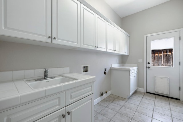 1552 N Gateway Ave, Clovis, CA 93619 - washroom featuring washer hookup, cabinet space, gas dryer hookup, and light tile patterned floors