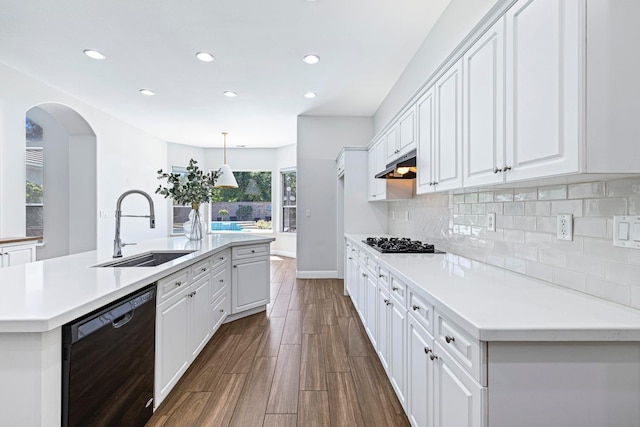 1552 N Gateway Ave, Clovis, CA 93619 - kitchen featuring black dishwasher, under cabinet range hood, white cabinetry, recessed lighting, and light countertops
