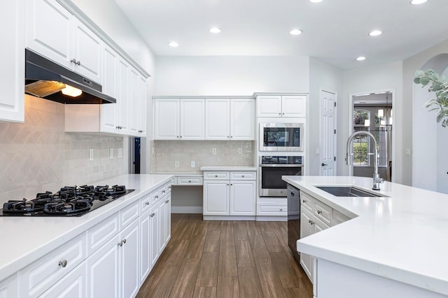 1552 N Gateway Ave, Clovis, CA 93619 - kitchen featuring stainless steel appliances, under cabinet range hood, dark wood-type flooring, recessed lighting, and white cabinets